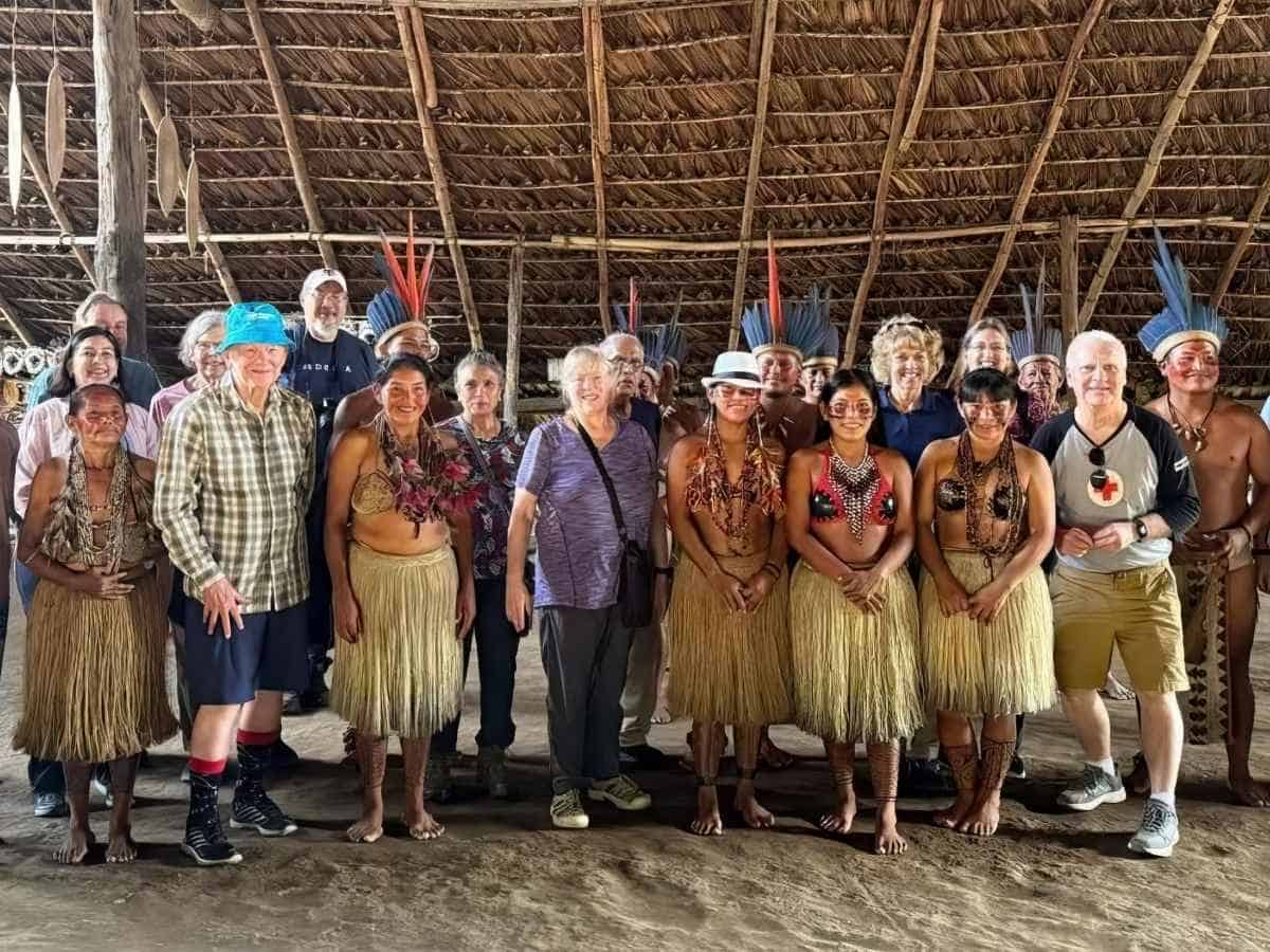 Global Travelers members with local people in the Amazon