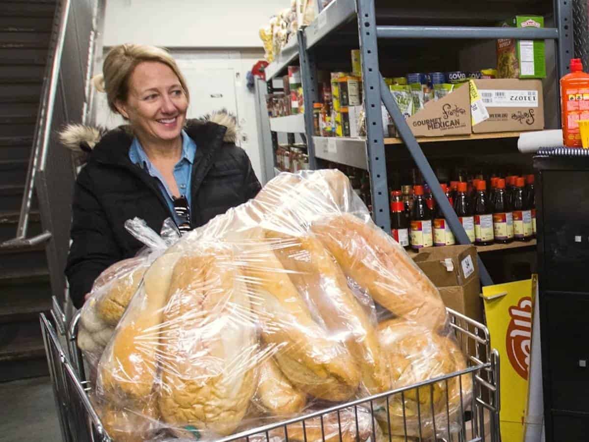 Basic Needs Woman pushing a cart full of bread