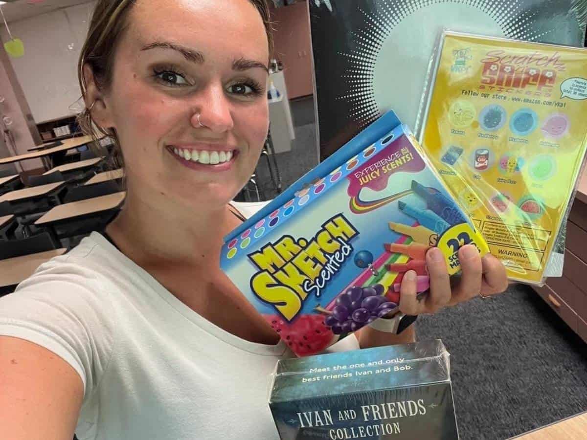 Educ & Lit Global Travelers member with school supplies to be donated