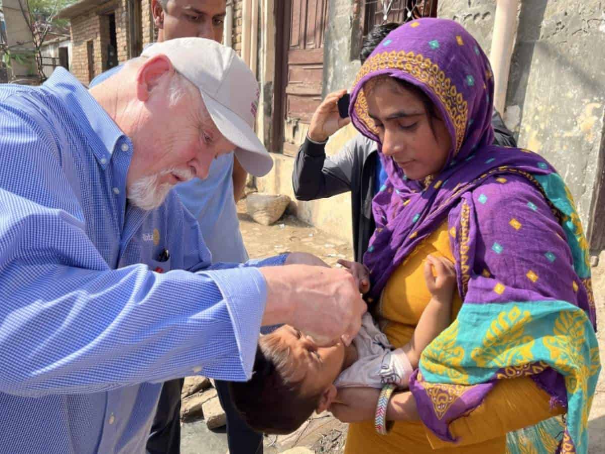 Sample 1 Rotarians delivering clothing to needy people