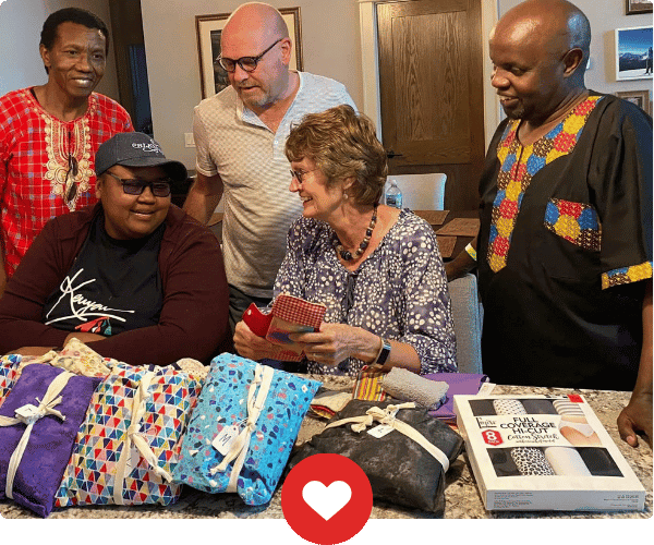Serve Rotarians delivering clothing to needy people