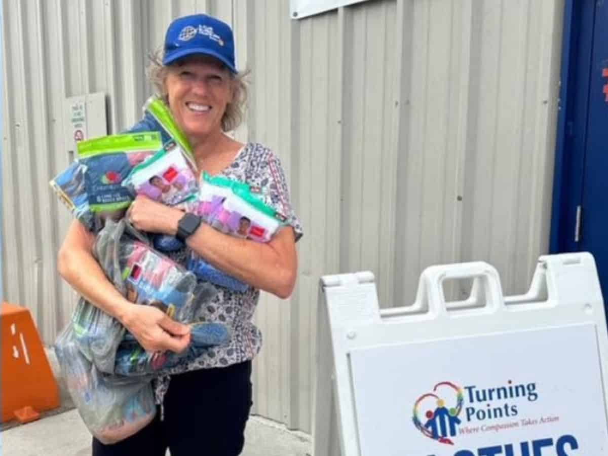Socks Global Traveler's member dropping off socks at a donation center